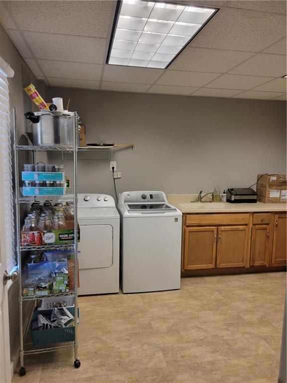 184 Scott Circle Toccoa, GA 30577 - Photo 28 of 52 a utility room with sink dryer and washer