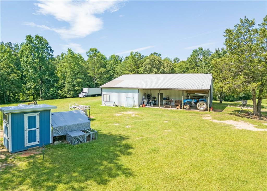 184 Scott Circle Toccoa, GA 30577 - Photo 36 of 52 a front view of a house with yard and swimming pool