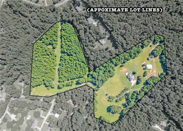 a view of a big yard with an outdoor seating