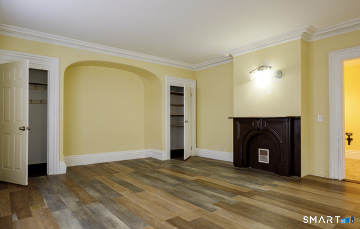 30 Main Street Plainfield, CT 06332 - Photo 3 of 14 a view of a livingroom with a fireplace and window
