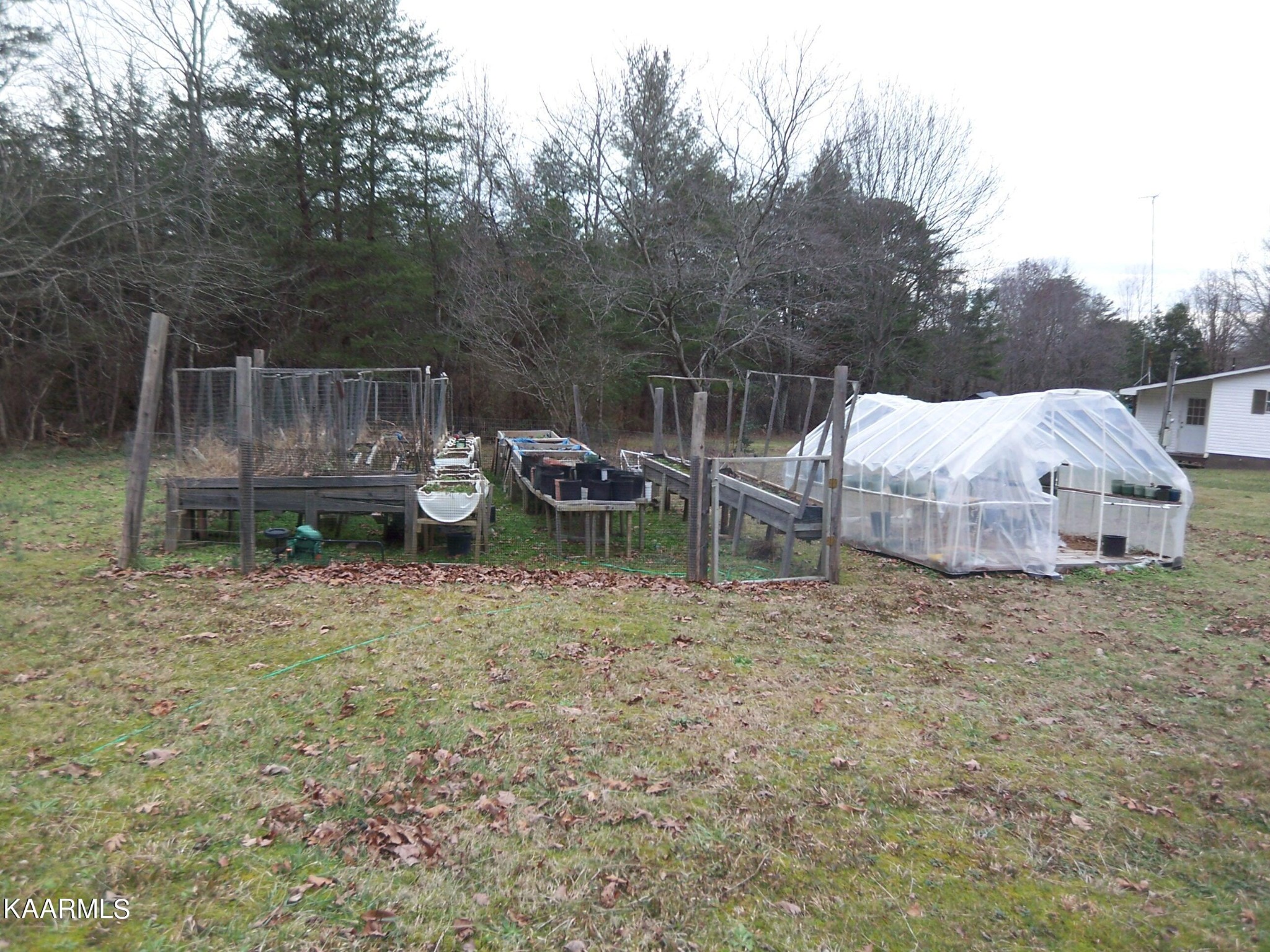 415 Kerrigan Road Crossville, TN 38555 - Photo 18 of 18 a backyard of a house with barbeque oven and outdoor seating