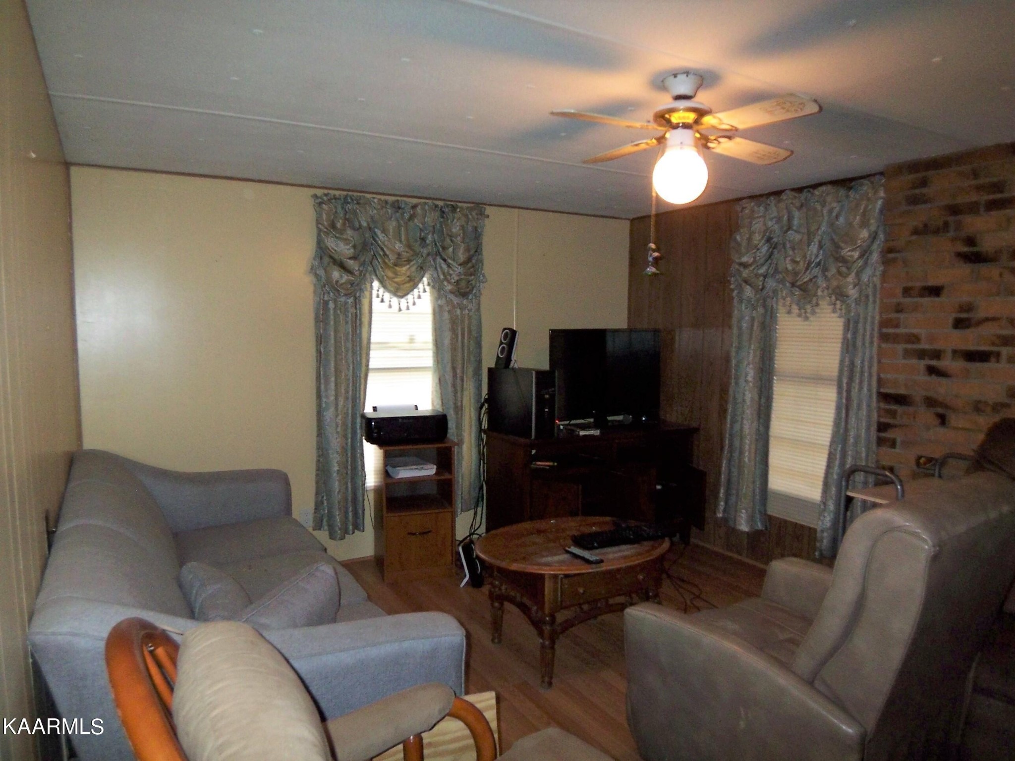 415 Kerrigan Road Crossville, TN 38555 - Photo 3 of 18 a living room with furniture and a flat screen tv