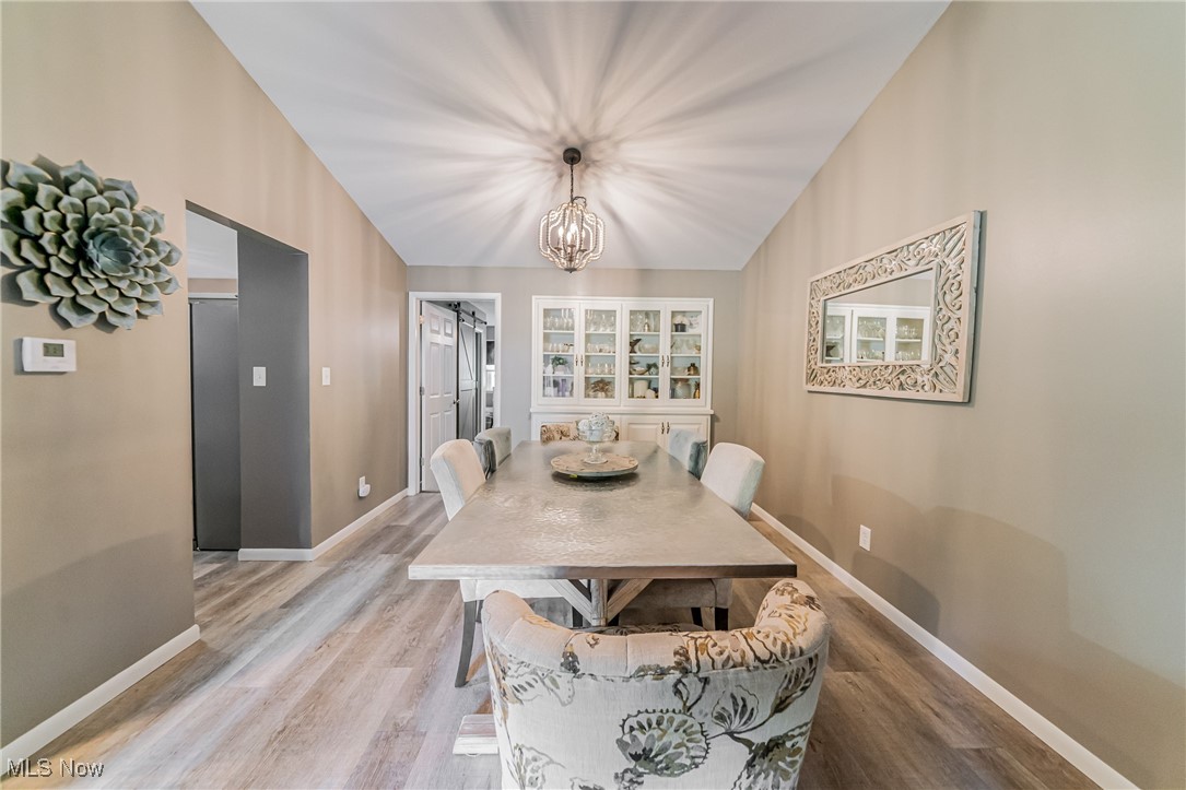 595 Moorfield Road Fairlawn, OH 44313 - Photo 7 of 50 Dining room with wood finished floors and a chandelier