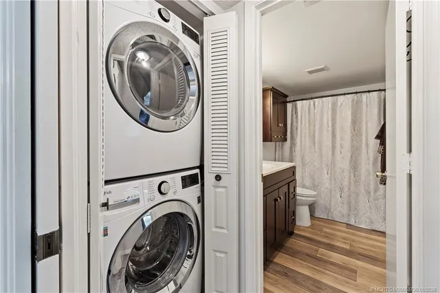 a view of a hallway with washer and dryer