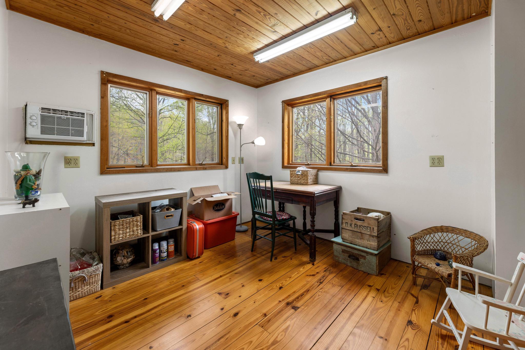 902 Harris Hollow Road Washington, VA 22747 - Photo 17 of 54 a living room with furniture a piano and a window