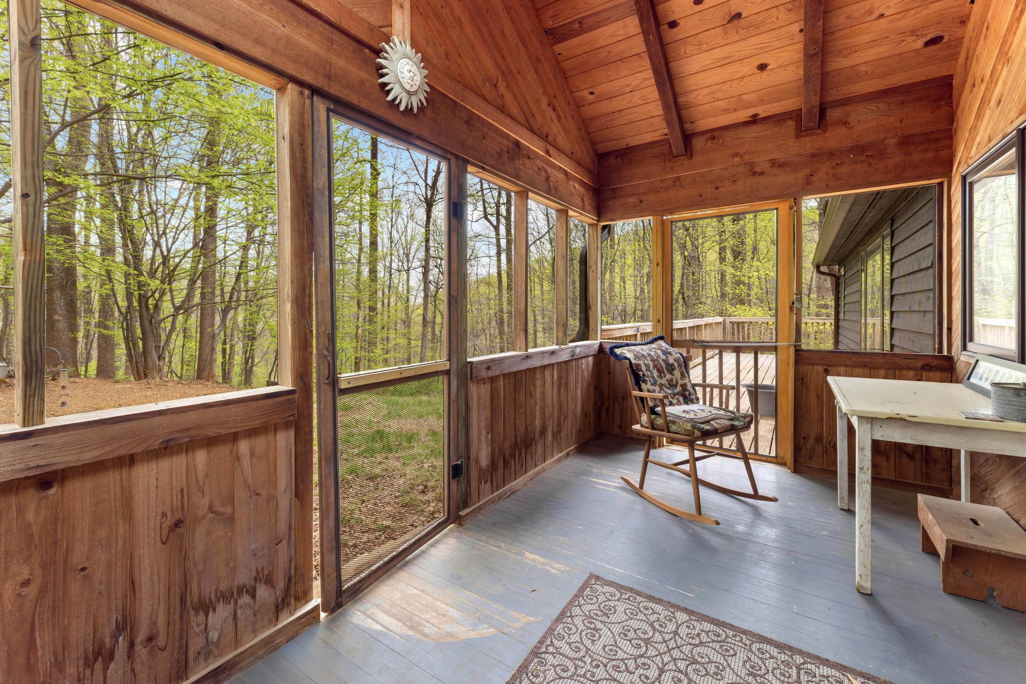 902 Harris Hollow Road Washington, VA 22747 - Photo 24 of 54 a living room with furniture and a floor to ceiling window
