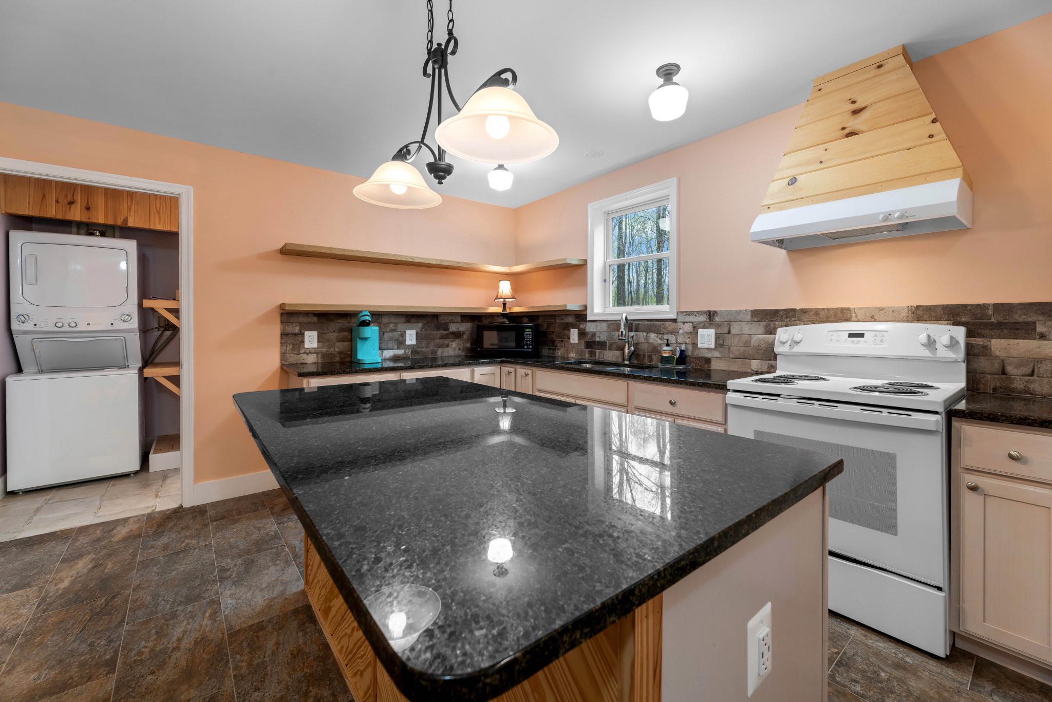 902 Harris Hollow Road Washington, VA 22747 - Photo 27 of 54 a kitchen with stainless steel appliances granite countertop a sink a stove and cabinets