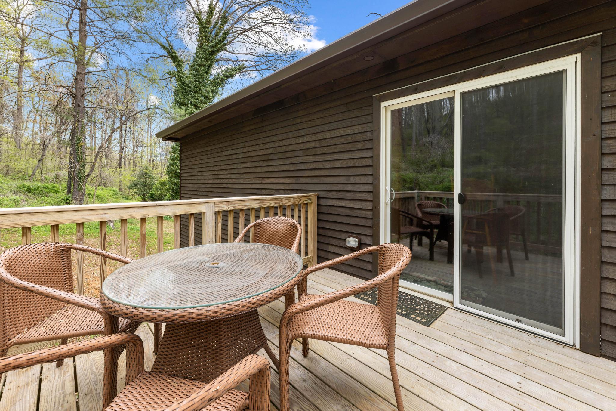 902 Harris Hollow Road Washington, VA 22747 - Photo 31 of 54 a view of a balcony with table and chairs