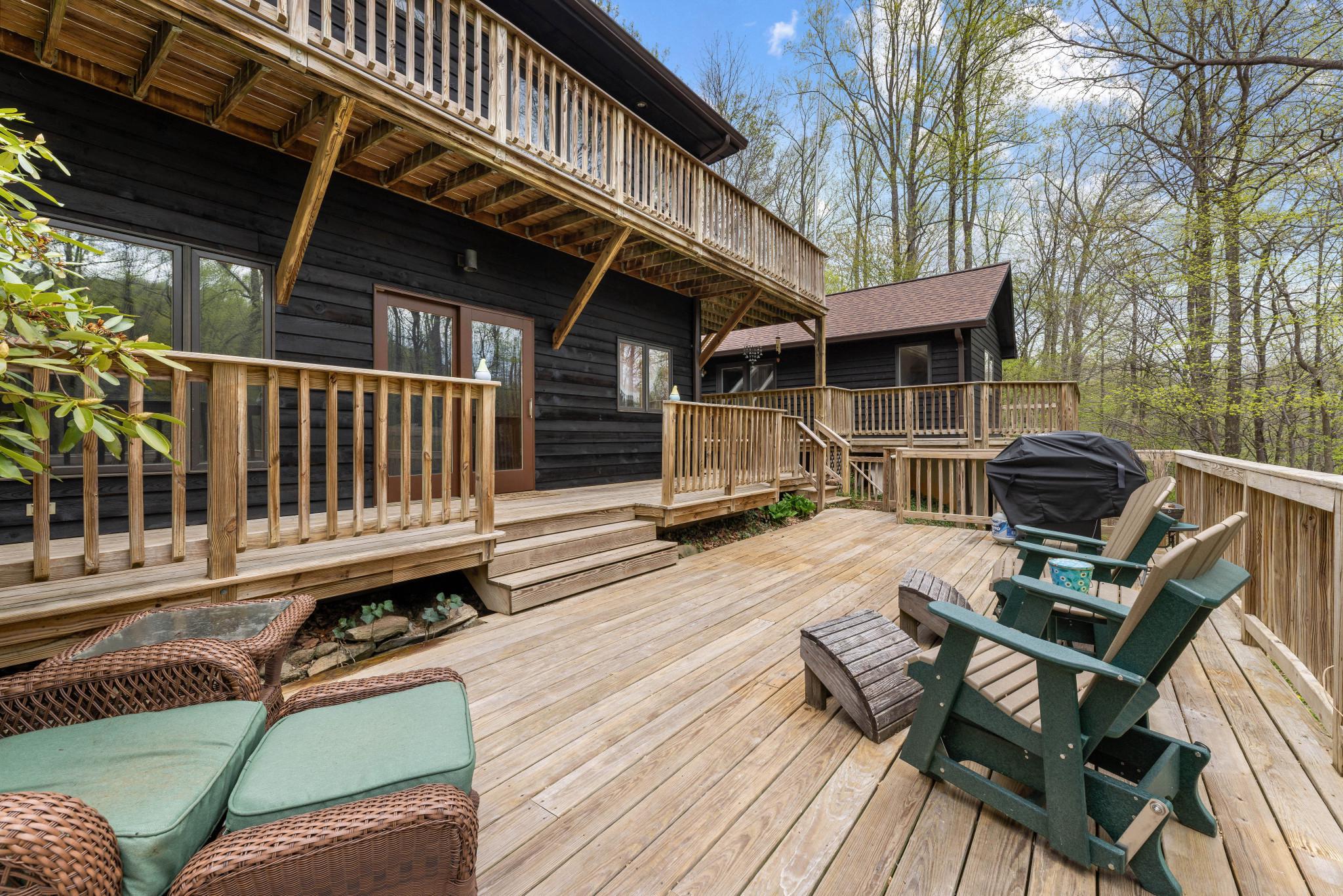 902 Harris Hollow Road Washington, VA 22747 - Photo 33 of 54 a view of a roof deck with wooden floor and outdoor seating