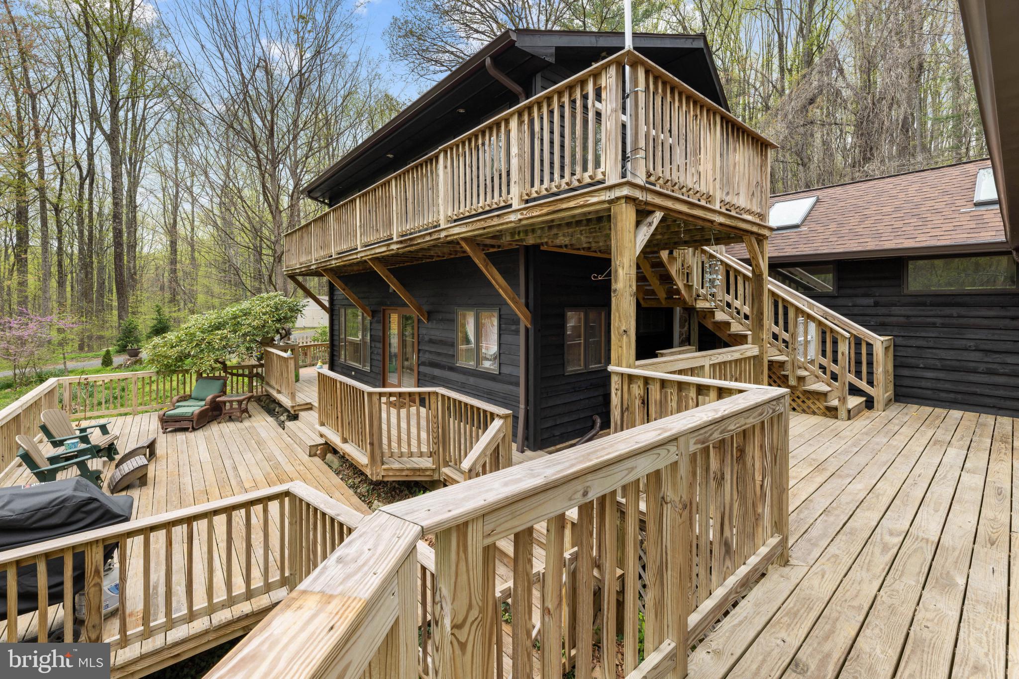 902 Harris Hollow Road Washington, VA 22747 - Photo 36 of 54 a view of a wooden house with large windows