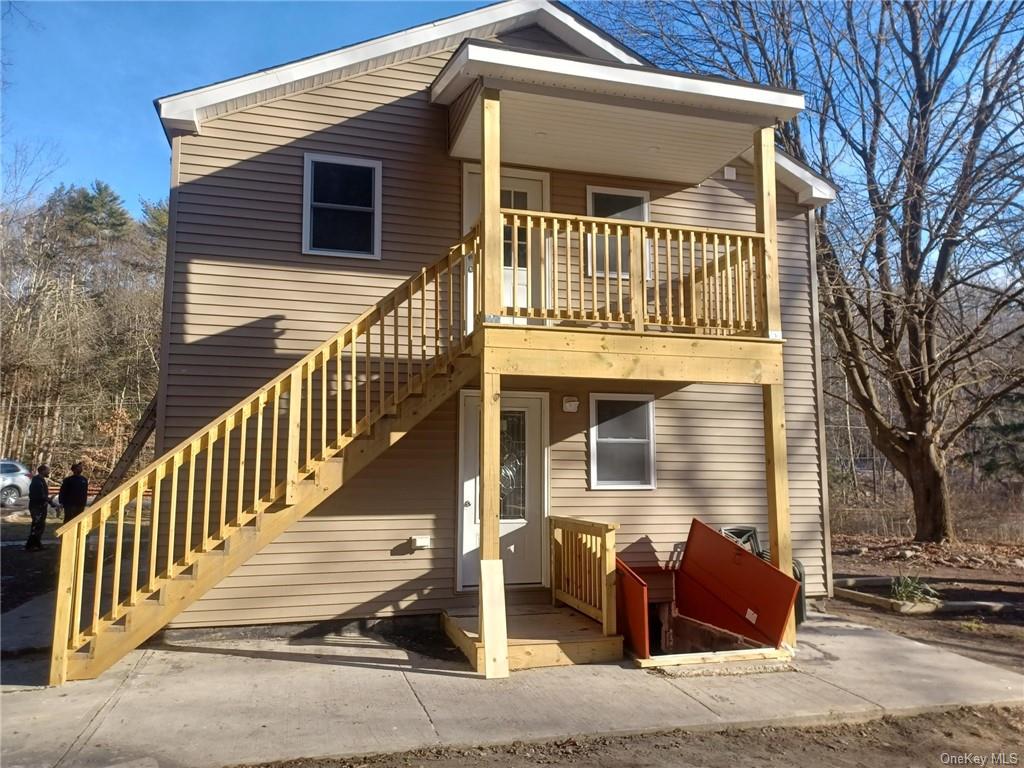 25 Bolton Basin Road Sparrowbush, NY 12780 - Photo 1 of 33 a front view of a house with iron fence