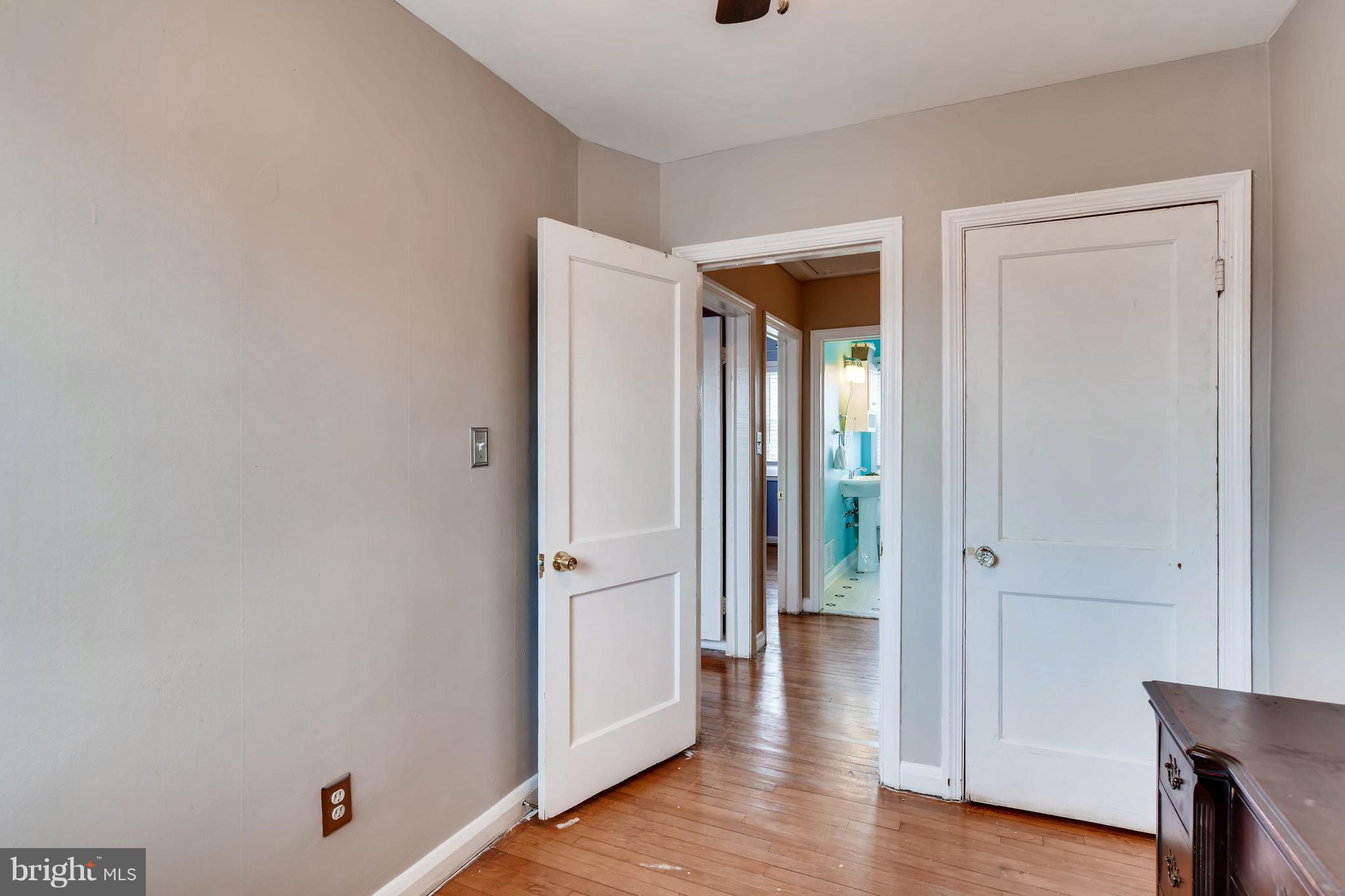8315 Ridgely Oak Road Baltimore, MD 21234 - Photo 17 of 26 wooden floor with white walls