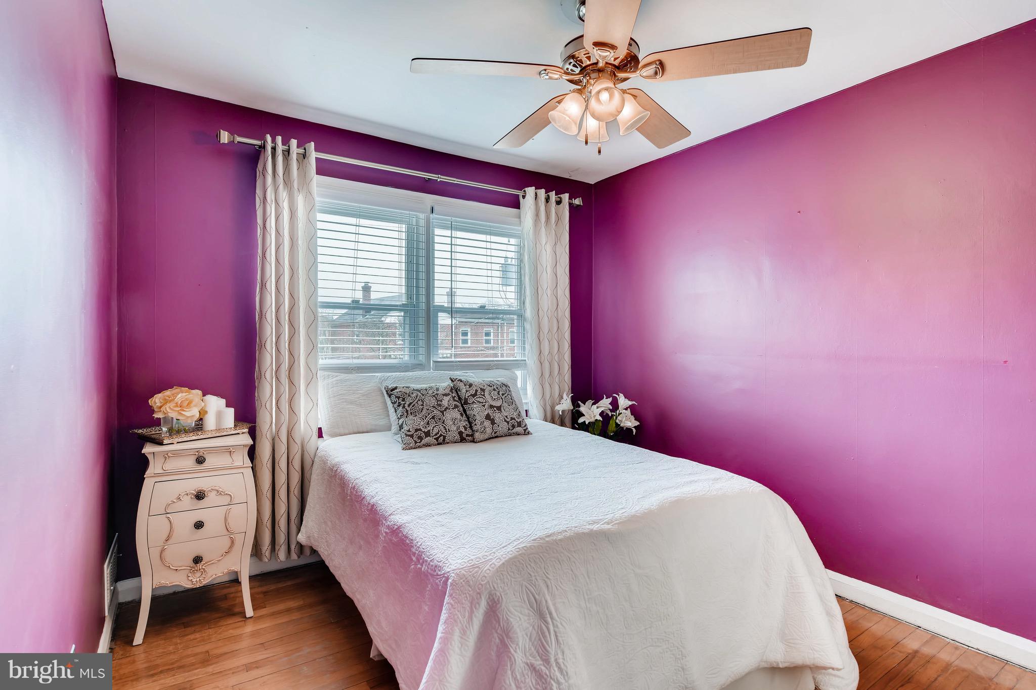 8315 Ridgely Oak Road Baltimore, MD 21234 - Photo 18 of 26 a bedroom with a bed and window