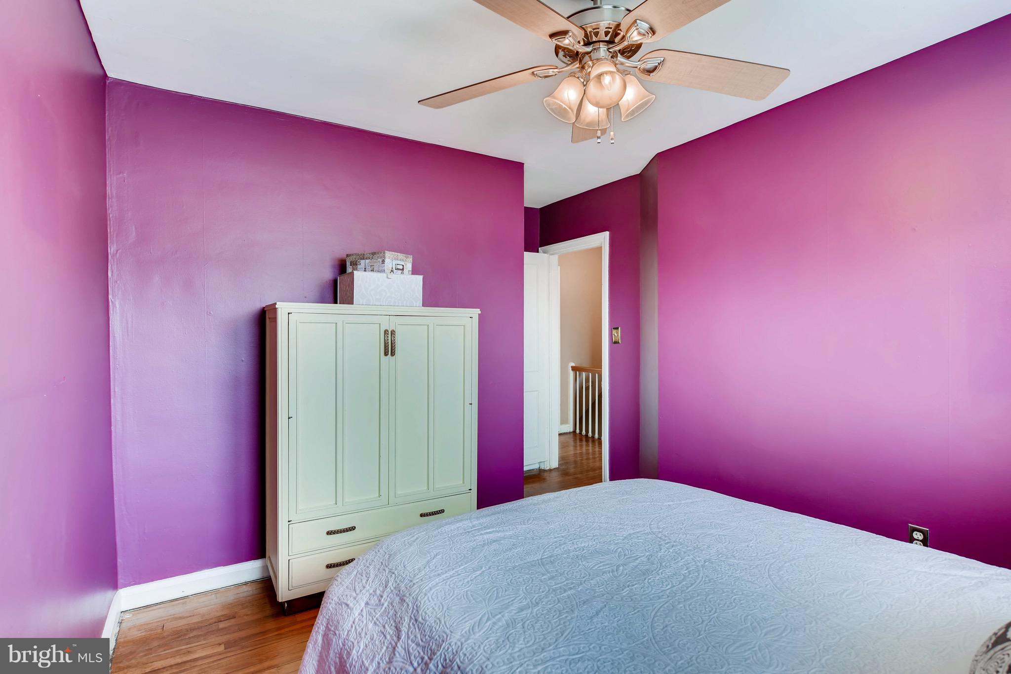 8315 Ridgely Oak Road Baltimore, MD 21234 - Photo 19 of 26 a bedroom with a bed and a mirror