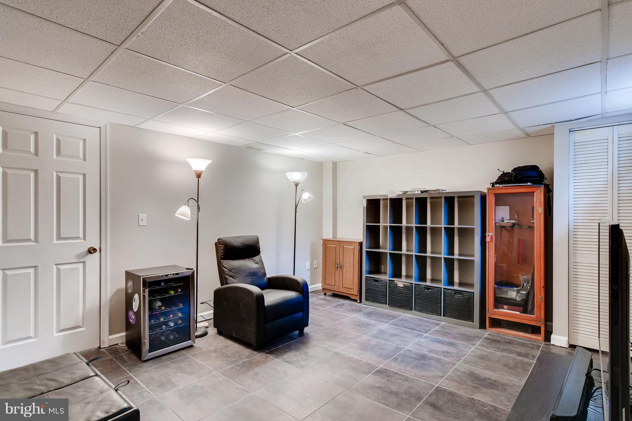 8315 Ridgely Oak Road Baltimore, MD 21234 - Photo 21 of 26 a living room with furniture and a bookshelf