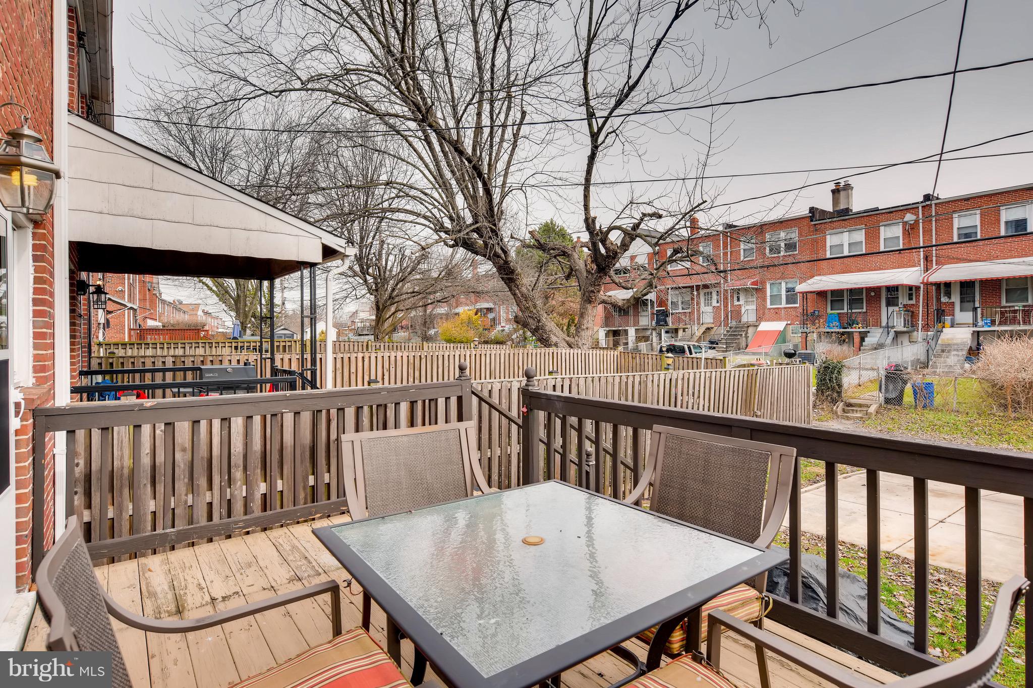 8315 Ridgely Oak Road Baltimore, MD 21234 - Photo 24 of 26 a view of a balcony with wooden floor and outdoor seating