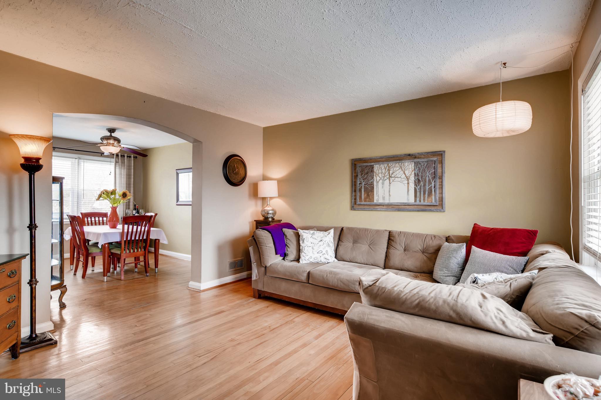 8315 Ridgely Oak Road Baltimore, MD 21234 - Photo 4 of 26 a living room with furniture and a wooden floor