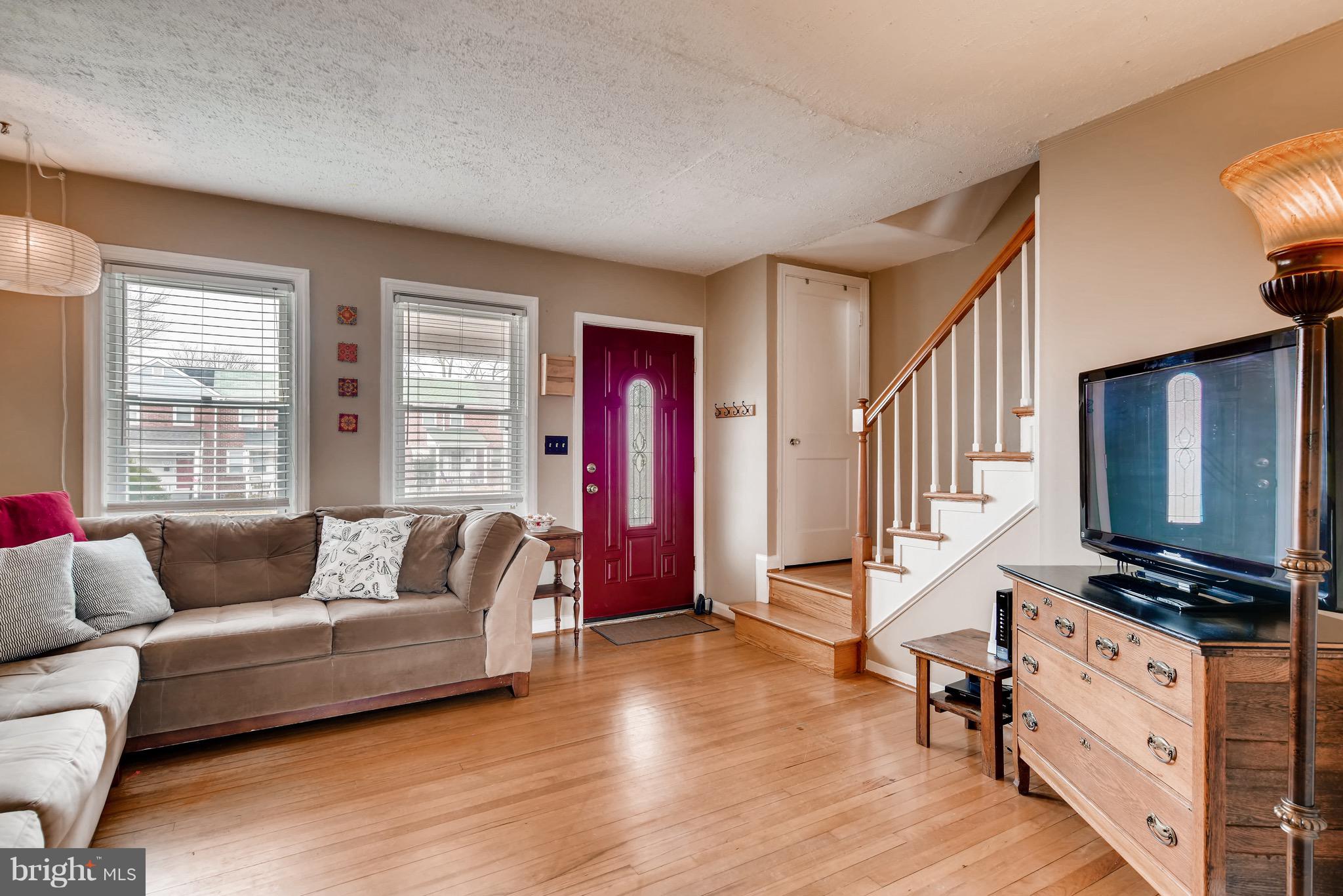 8315 Ridgely Oak Road Baltimore, MD 21234 - Photo 6 of 26 a living room with furniture windows and wooden floor