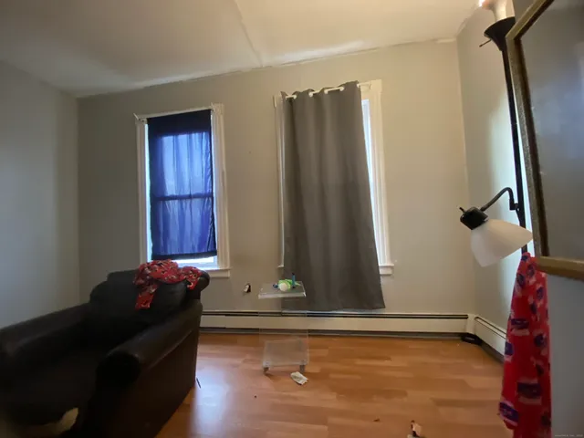 a bedroom with a bed and furniture