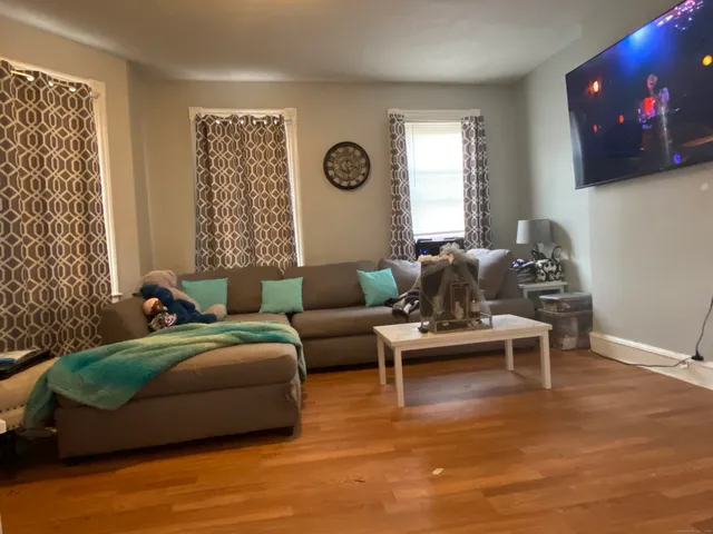 a bedroom with a bed and flat screen tv