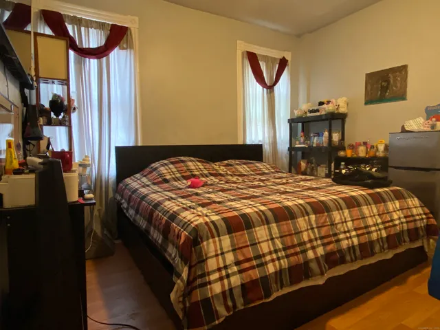 a bedroom with a bed and a closet