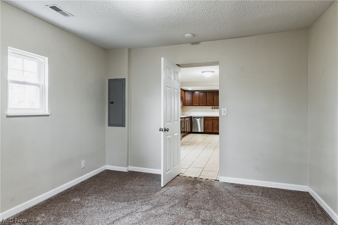 2815 Sealy Ridge Road Vincent, OH 45784 - Photo 15 of 21 Unfurnished bedroom with light colored carpet and a textured ceiling