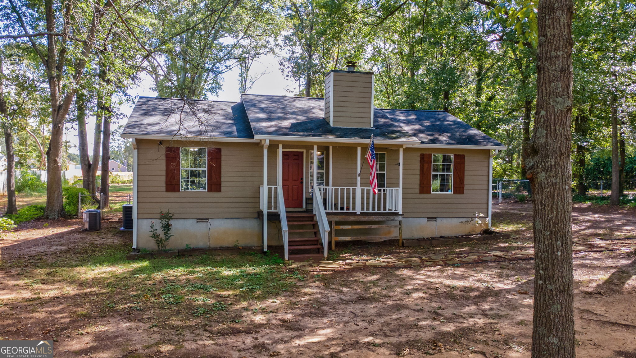 front view of a house with a yard