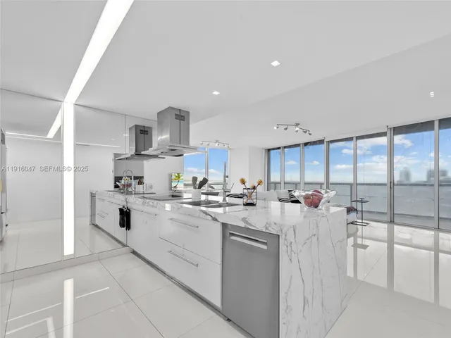 a kitchen with sink cabinets and window