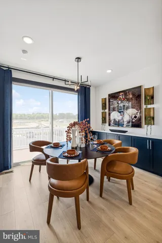 a living room with furniture a rug and a large window