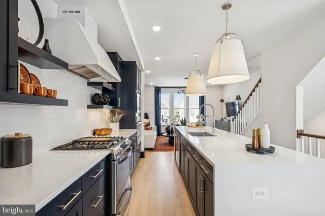 a kitchen with lots of counter top space a sink and appliances