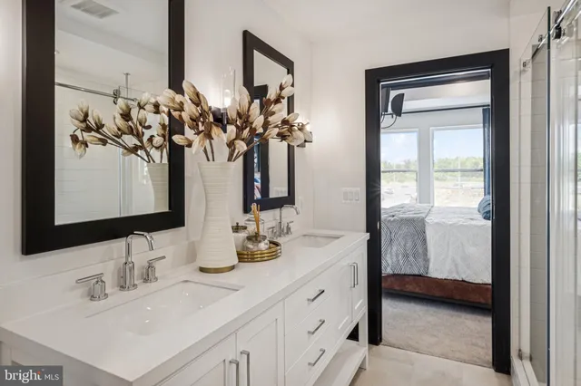 a bathroom with sink mirror and vanity