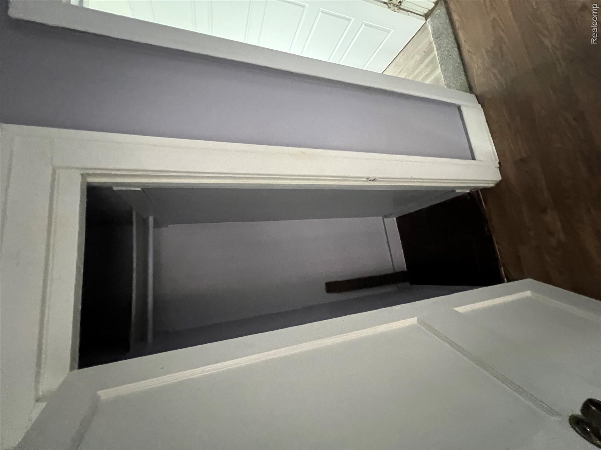 4740-4742 Alter Road Detroit, MI 48215 - Photo 7 of 20 Recessed closet featuring an integrated hanging rod and upper shelf storage
