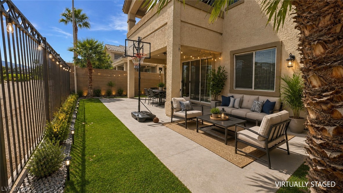 87 Tall Ruff Drive Las Vegas, NV 89148 - Photo 29 of 71 An inviting covered patio and lush lawn define this private backyard oasis.