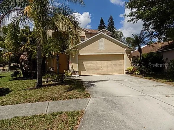 a view of a house with a yard