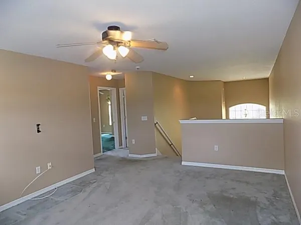 a view of a hallway with a chandelier