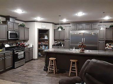 a kitchen with counter top space cabinets and stainless steel appliances