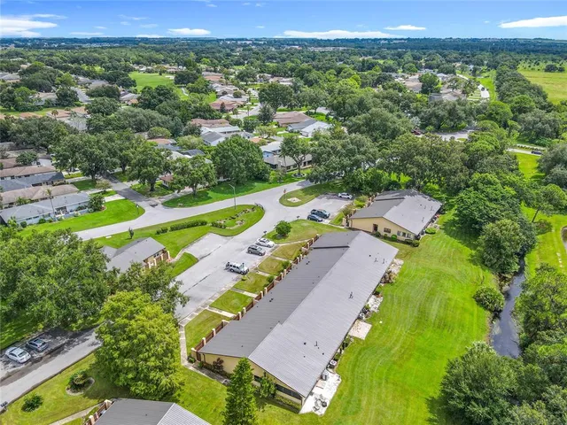 swimming pool view with a seating space