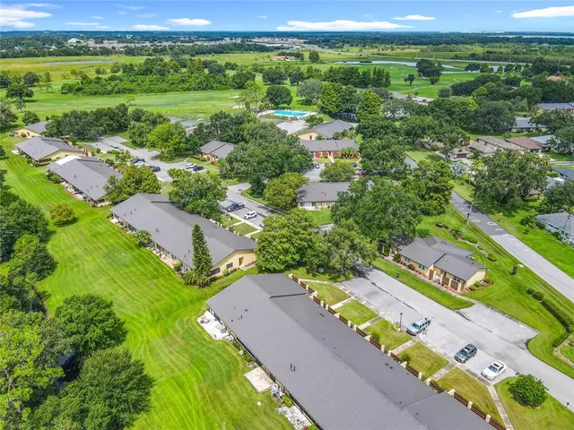 a view of a swimming pool with an outdoor space and seating area