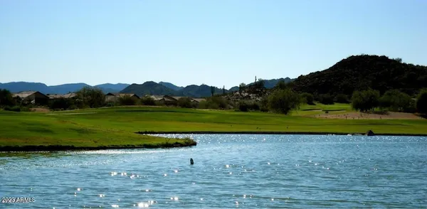 a view of a golf course with a lake