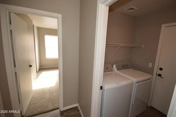 a utility room with dryer and washer