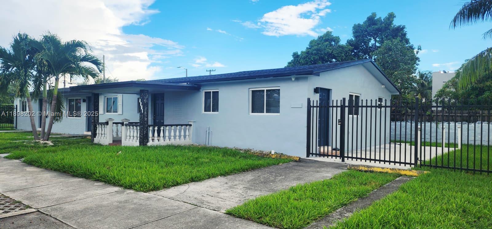 a view of backyard with a garden and plants