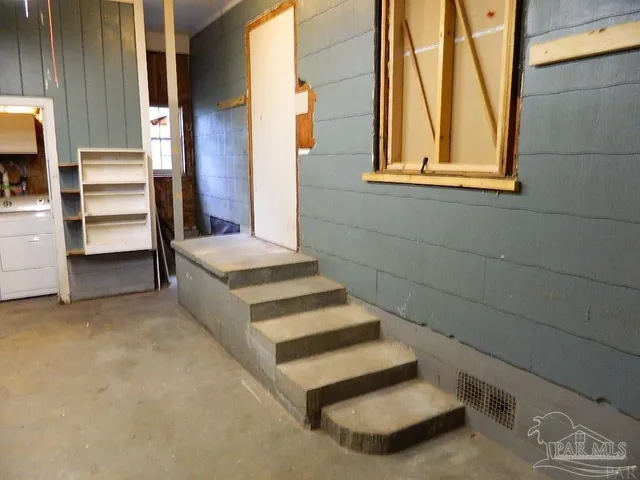 a view of an empty room with a window