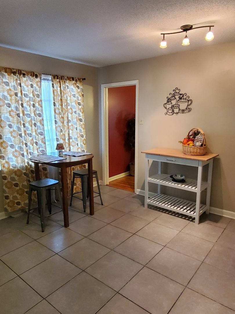 3232 Canisbay Road Memphis, TN 38128 - Photo 12 of 23 a room with furniture and a large window