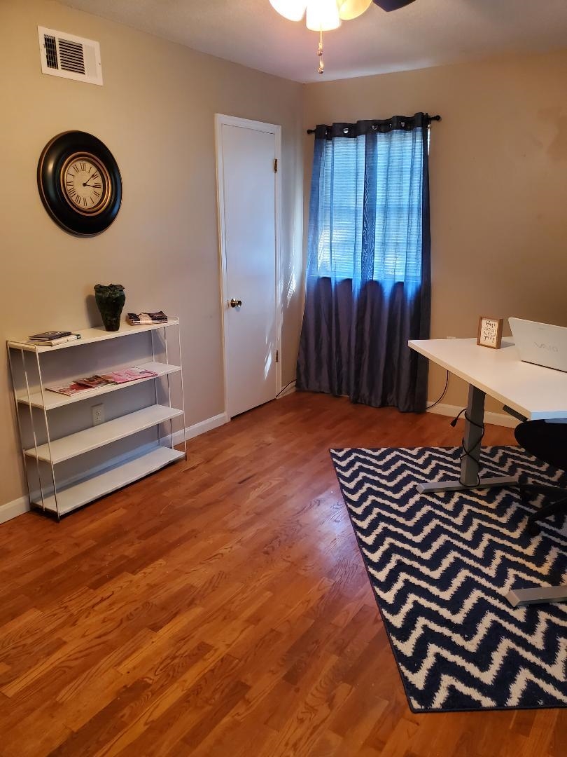3232 Canisbay Road Memphis, TN 38128 - Photo 18 of 23 a view of a room with shelves and wooden floor