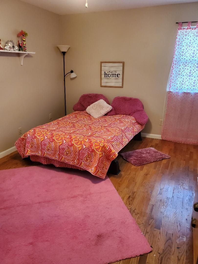3232 Canisbay Road Memphis, TN 38128 - Photo 19 of 23 a bedroom with a bed and a night stand