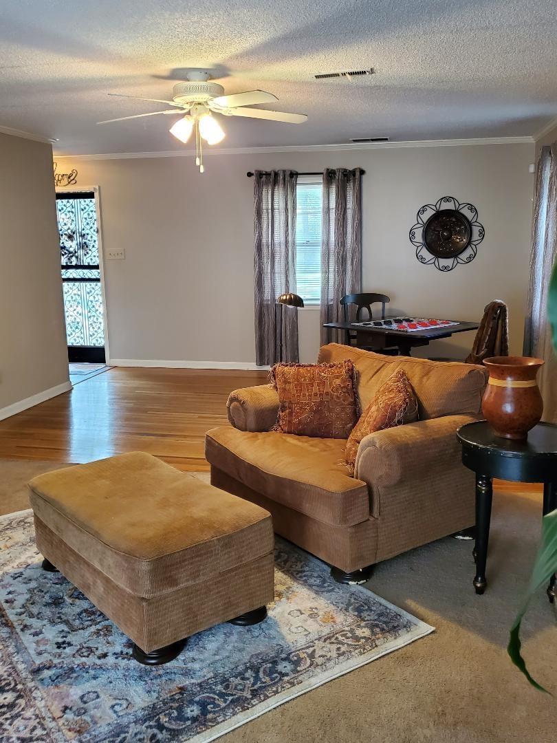3232 Canisbay Road Memphis, TN 38128 - Photo 3 of 23 a living room with furniture and a wooden floor