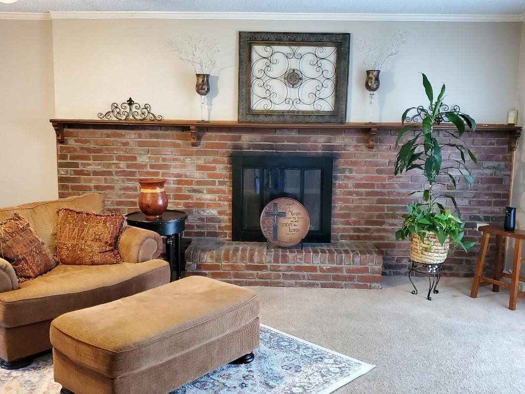 3232 Canisbay Road Memphis, TN 38128 - Photo 4 of 23 a living room with furniture and a fireplace