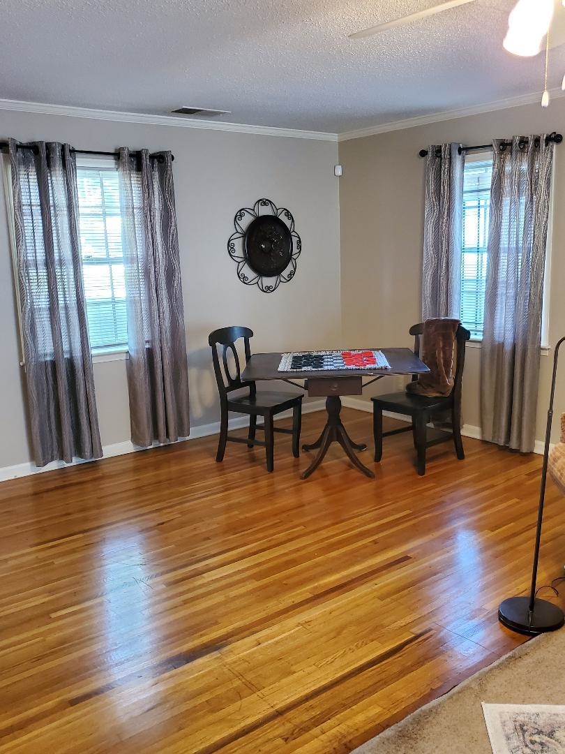3232 Canisbay Road Memphis, TN 38128 - Photo 5 of 23 a living room with furniture and wooden floor