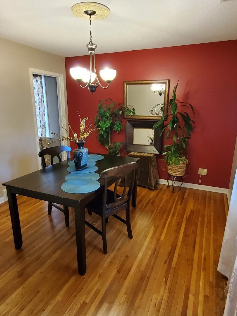 3232 Canisbay Road Memphis, TN 38128 - Photo 8 of 23 a view of a dining room with furniture and wooden floor