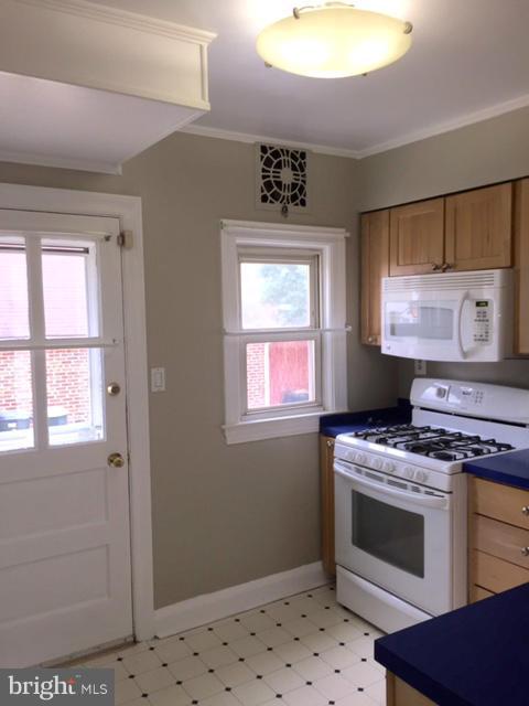 3014 Dunmurry Road Baltimore, MD 21222 - Photo 11 of 24 a kitchen with a stove and a cabinet